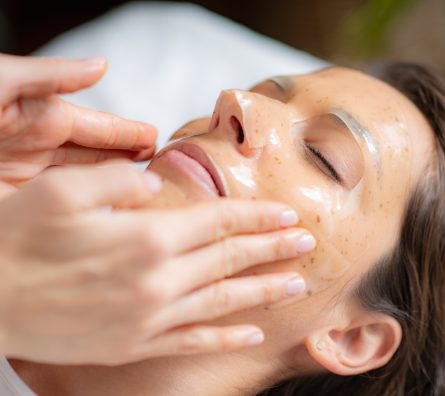 Woman at the beauty salon enjoys a rejuvenating skincare face mask treatment Woman at the beauty salon enjoys a rejuvenating skincare face mask treatment