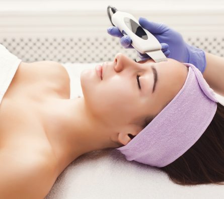 Woman getting facial treatment at beauty salon Woman getting facial treatment at beauty salon